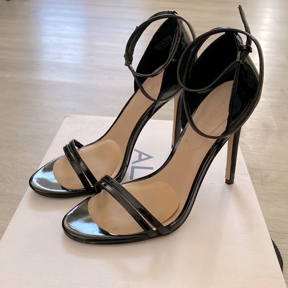 ALDO black patent leather heels with ankle wrapped around strap.